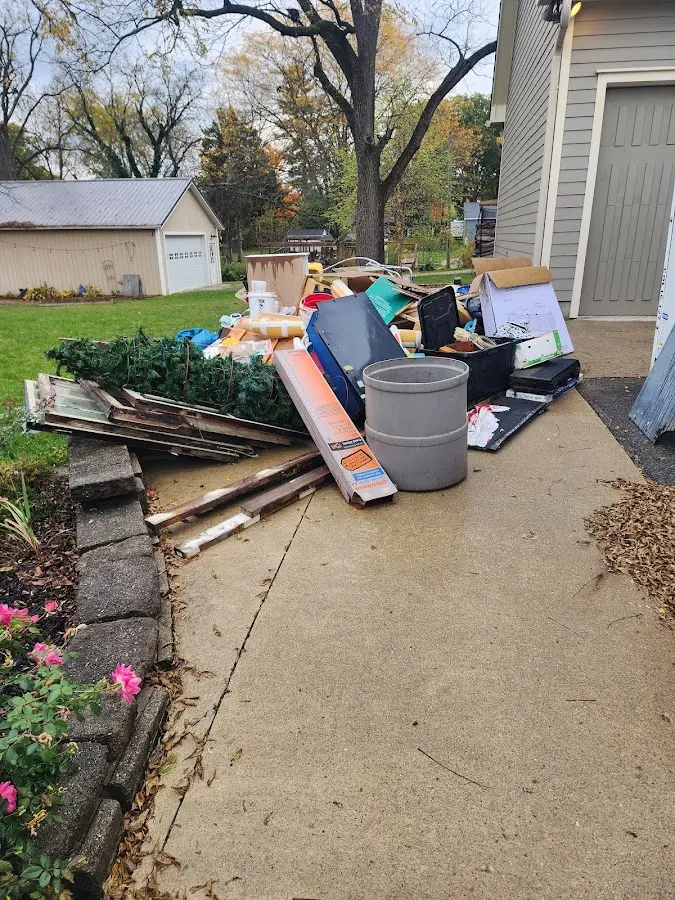Dumpster being loaded with debris for 30 Yard Dumpster Rental in Northridge